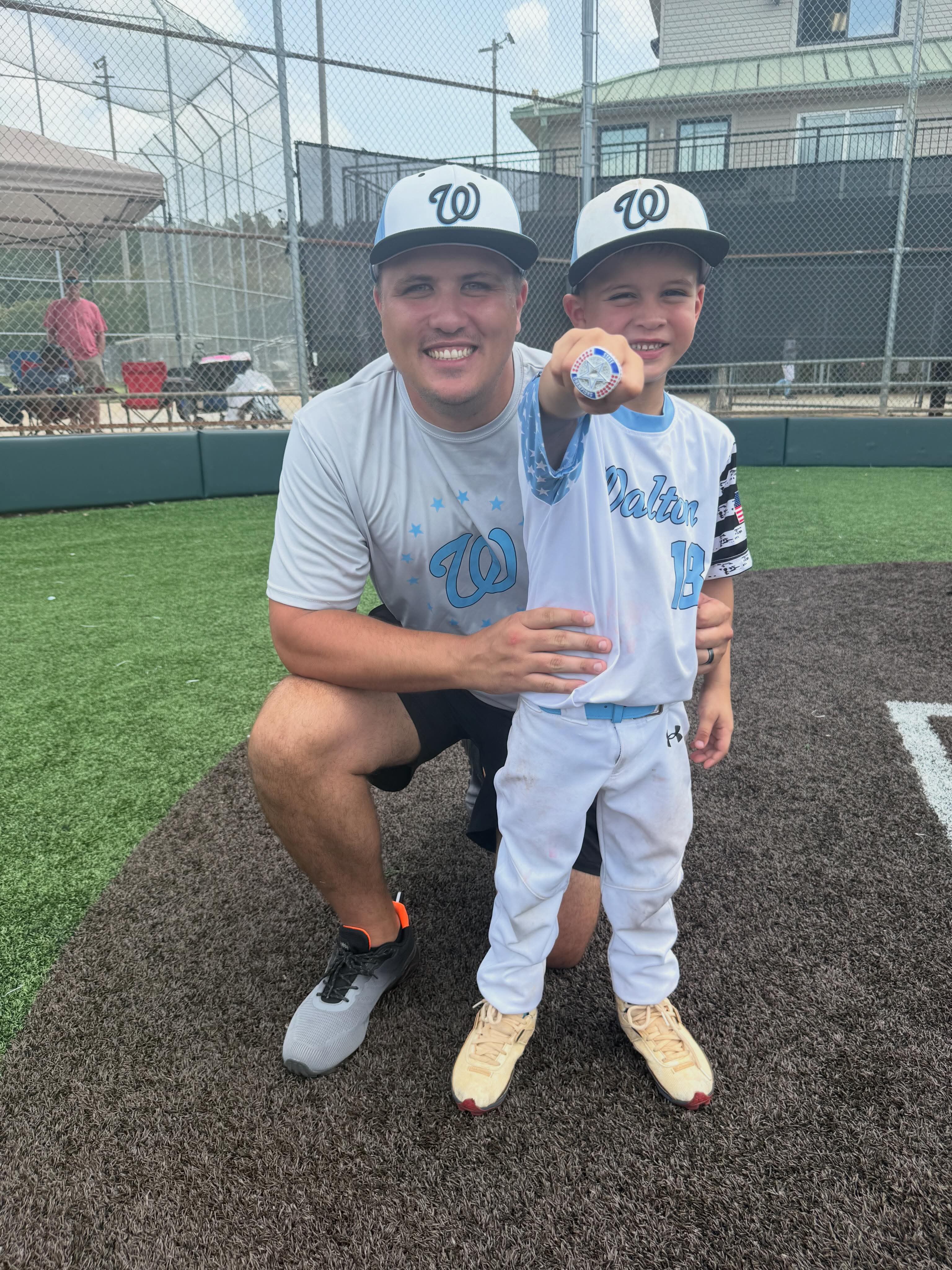 Joshua Davis with his son at the baseball field